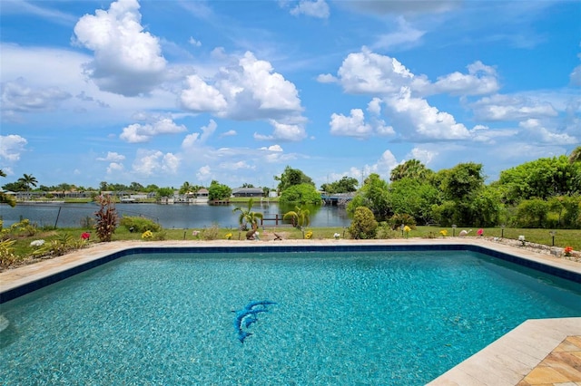 view of swimming pool with a water view