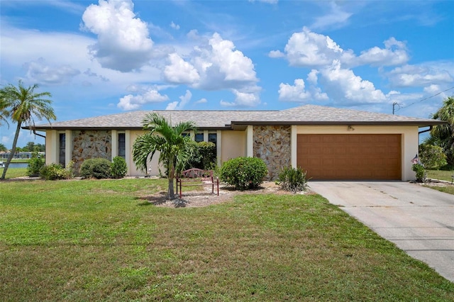 ranch-style house featuring a front lawn and a garage