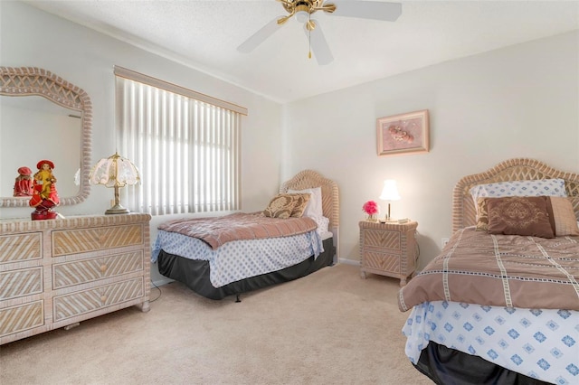 bedroom with ceiling fan and carpet flooring