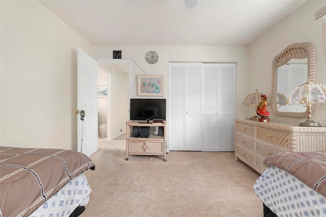 carpeted bedroom featuring a closet