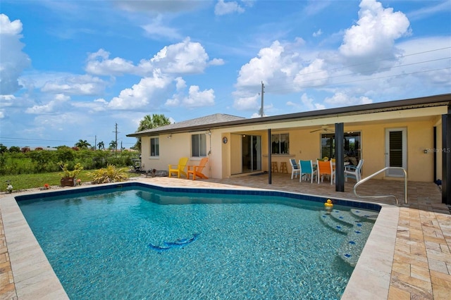 view of pool featuring ceiling fan and a patio