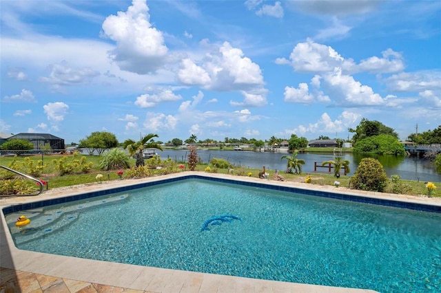 view of pool with a water view