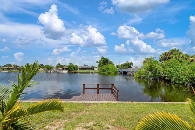 view of dock featuring a water view and a lawn