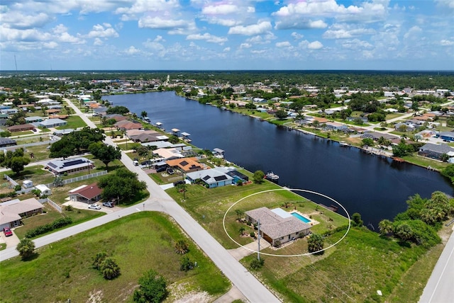 bird's eye view with a water view