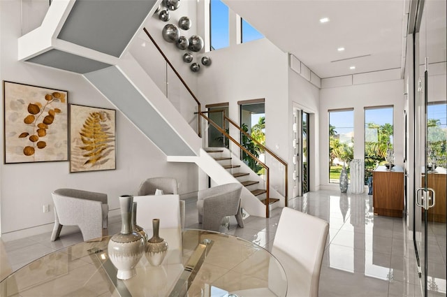 dining space with a high ceiling