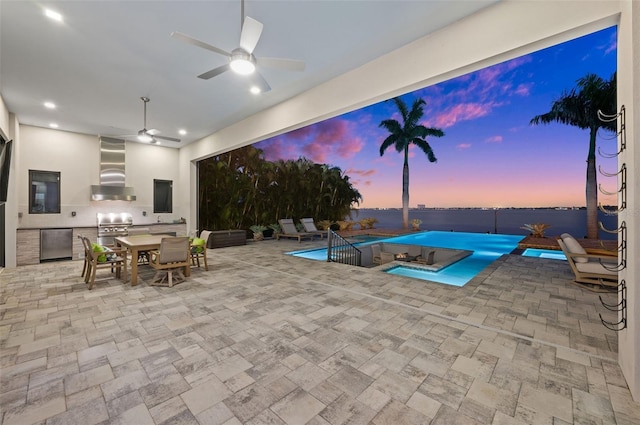 pool at dusk featuring ceiling fan and grilling area