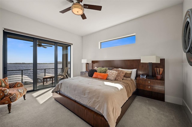 bedroom featuring carpet floors, multiple windows, and access to outside