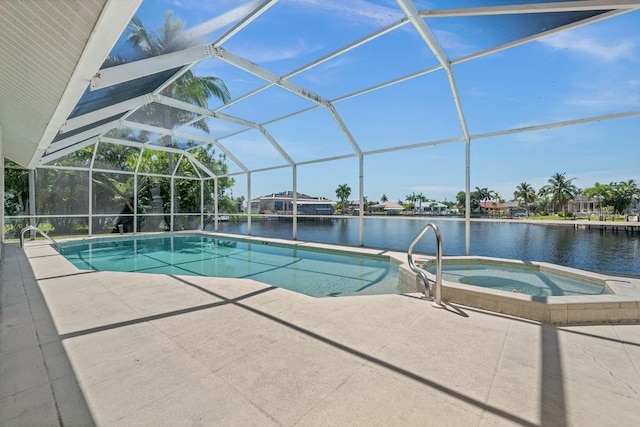 view of swimming pool featuring glass enclosure, a patio area, an in ground hot tub, and a water view