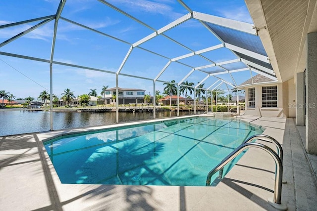 view of swimming pool with glass enclosure, a water view, and a patio