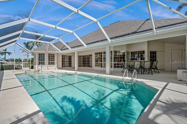 view of swimming pool with a lanai and a patio