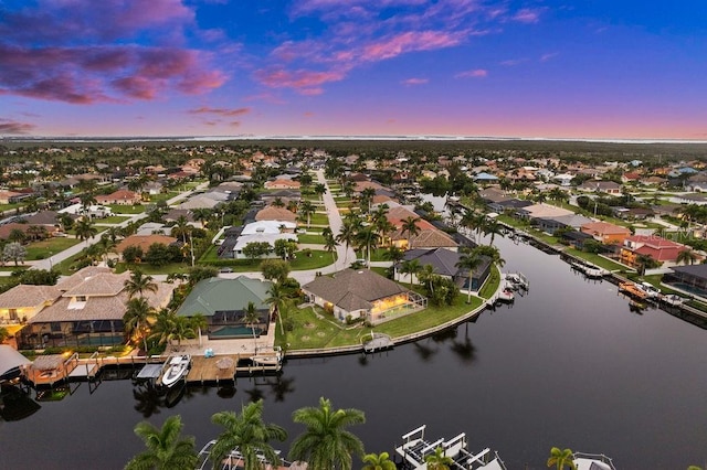 aerial view at dusk with a water view