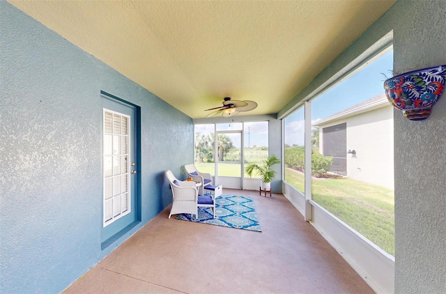 sunroom / solarium with ceiling fan