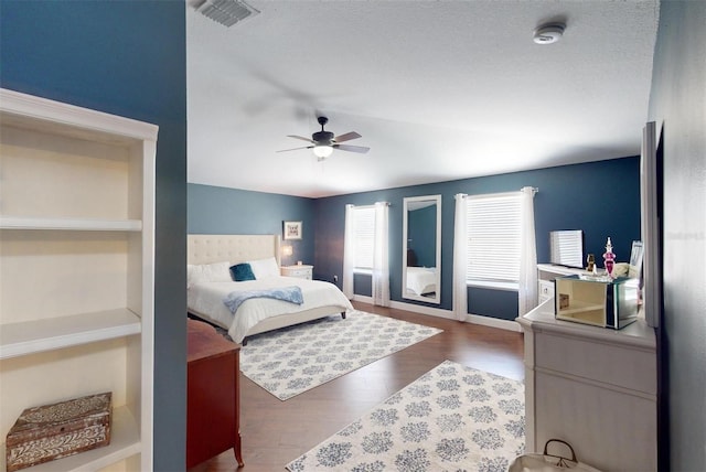 bedroom featuring ceiling fan, dark hardwood / wood-style floors, and vaulted ceiling