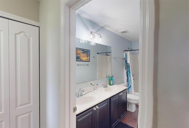 full bathroom featuring vanity, toilet, and shower / bath combo with shower curtain