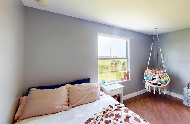 bedroom featuring dark wood-type flooring