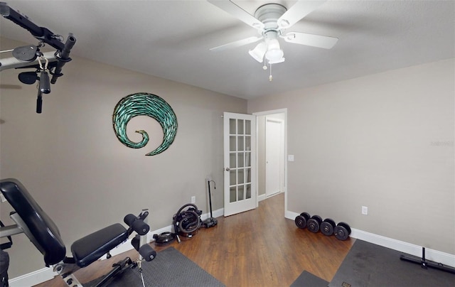 workout room with ceiling fan, dark hardwood / wood-style flooring, and french doors