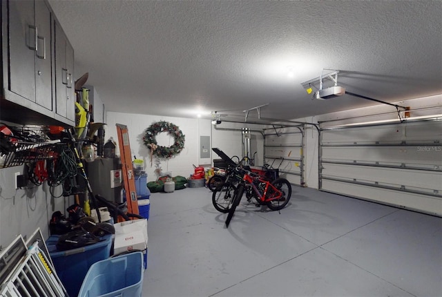 garage featuring a garage door opener, electric panel, and water heater