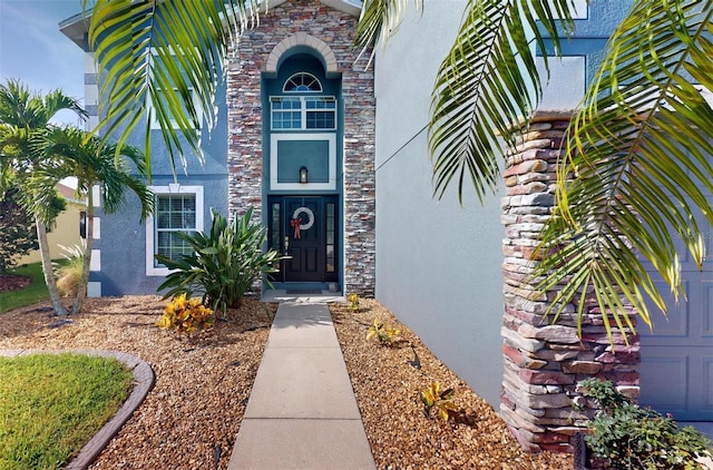 2736 Suncoast Lakes Blvd, Punta Gorda, FL 33980 - property entrance featuring stucco siding and stone siding