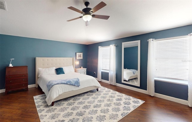 bedroom featuring ceiling fan and dark hardwood / wood-style flooring