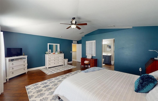 bedroom featuring ensuite bathroom, lofted ceiling, dark wood-type flooring, and ceiling fan