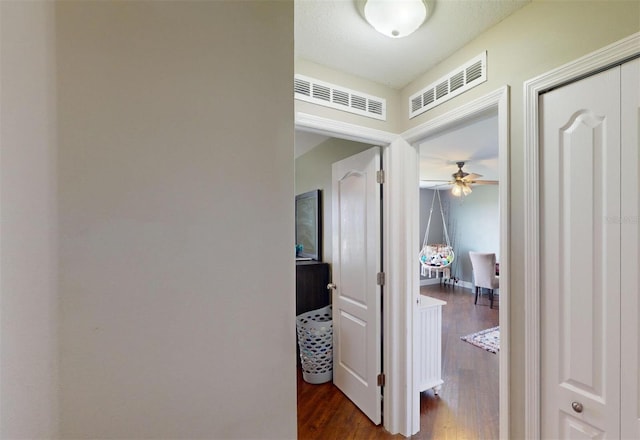 hall with dark hardwood / wood-style floors