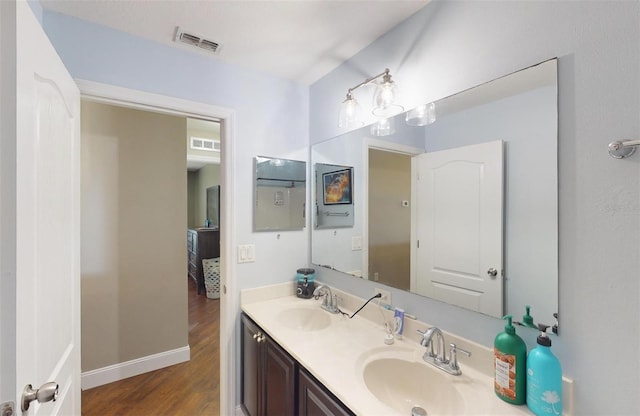 bathroom with vanity and hardwood / wood-style floors