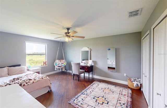 bedroom with ceiling fan and dark hardwood / wood-style flooring