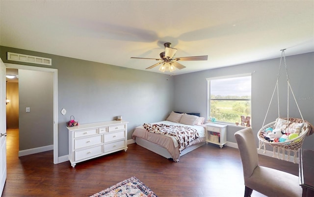 bedroom featuring dark hardwood / wood-style floors and ceiling fan