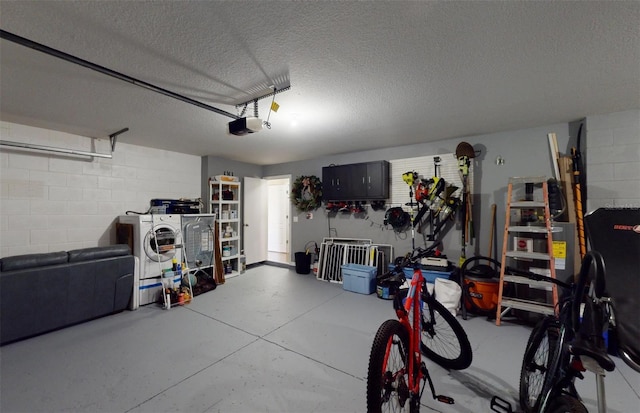 garage featuring a garage door opener and washing machine and dryer