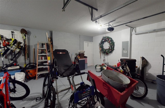 garage with a garage door opener and electric panel