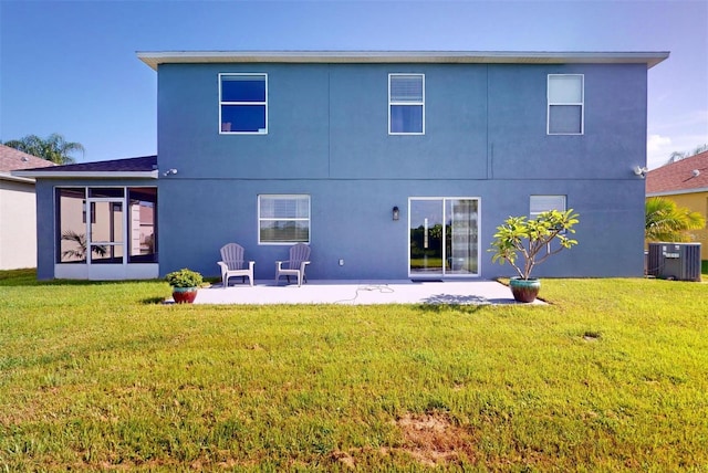 rear view of house featuring central AC, a patio, and a lawn