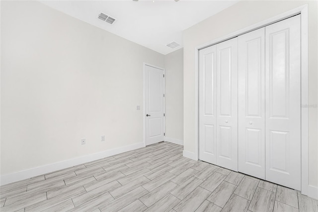 unfurnished bedroom featuring a closet