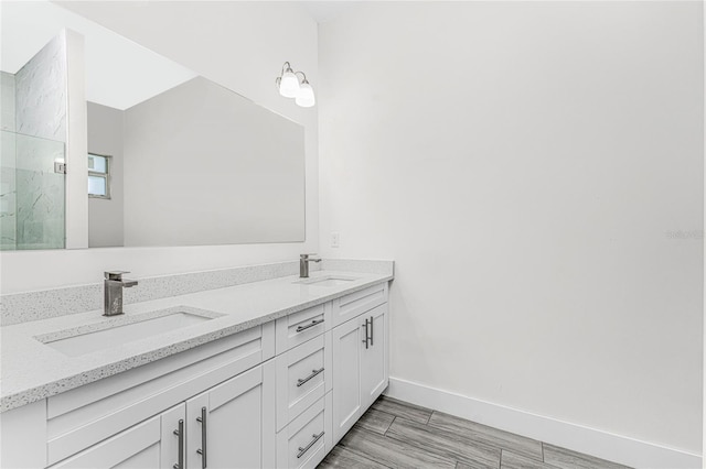 bathroom with vanity and walk in shower