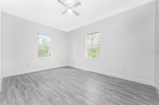 unfurnished room featuring ceiling fan and light wood-type flooring