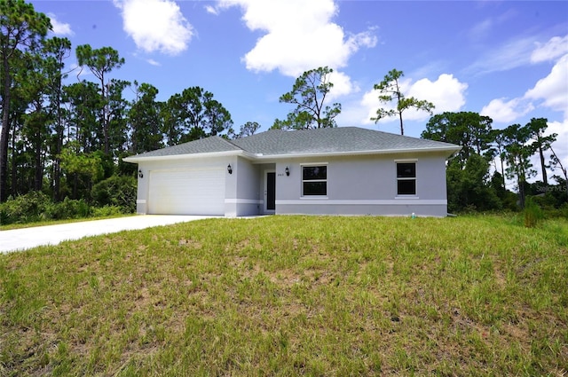 ranch-style house featuring a garage and a front lawn