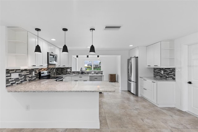 kitchen featuring kitchen peninsula, white cabinets, stainless steel appliances, and sink