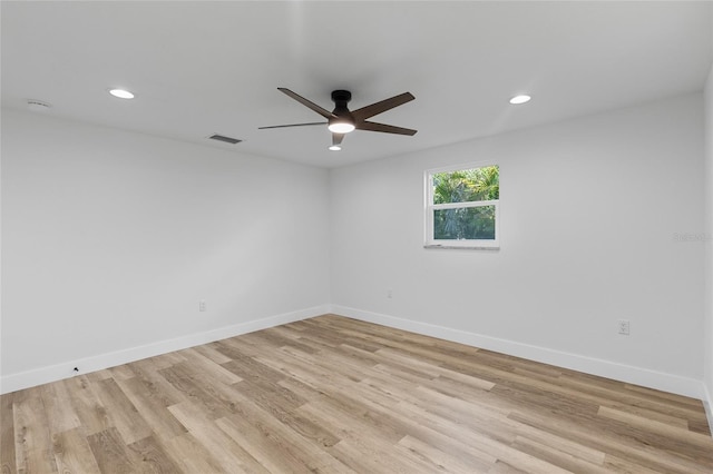 spare room with light hardwood / wood-style flooring and ceiling fan