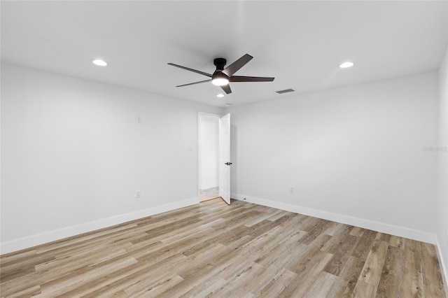 empty room with light hardwood / wood-style floors and ceiling fan