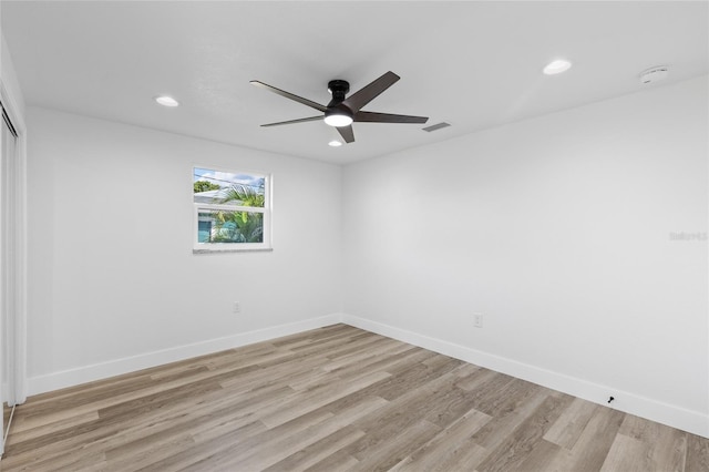 empty room with light hardwood / wood-style floors and ceiling fan