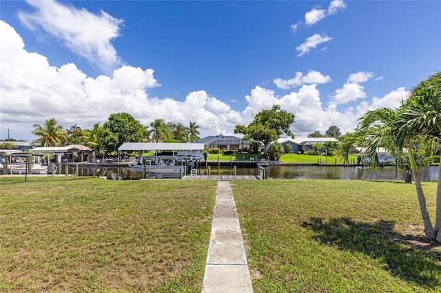 surrounding community with a water view, a boat dock, and a lawn