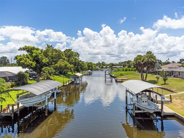 view of dock featuring a yard and a water view