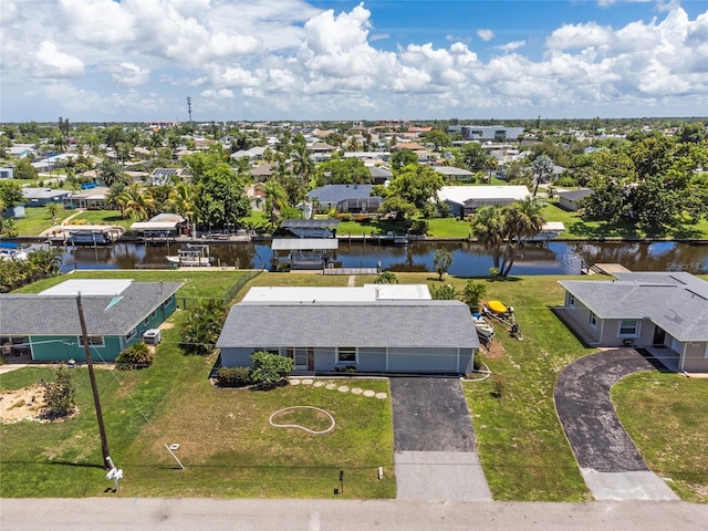 bird's eye view featuring a residential view and a water view