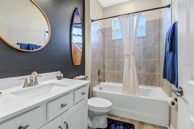 full bathroom featuring vanity, shower / tub combo with curtain, toilet, and hardwood / wood-style flooring