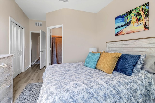 bedroom featuring a closet and light wood-type flooring