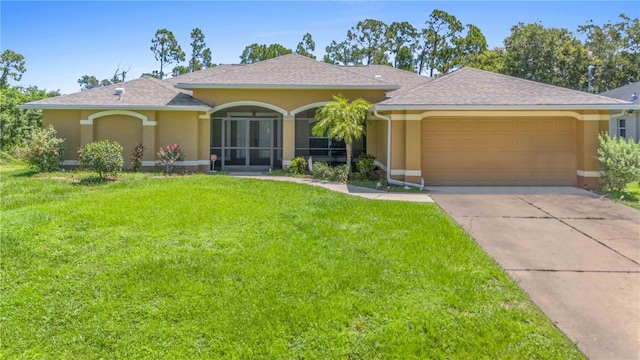 ranch-style home featuring a front lawn and a garage