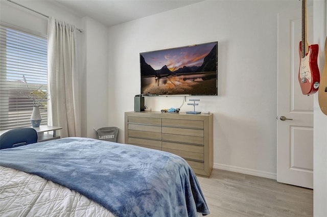 bedroom featuring light wood-type flooring