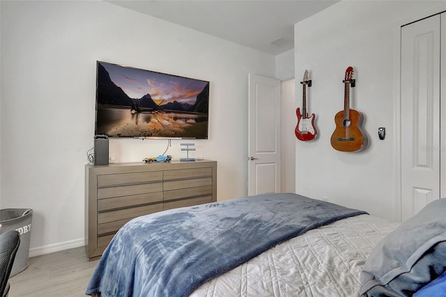 bedroom with light hardwood / wood-style floors