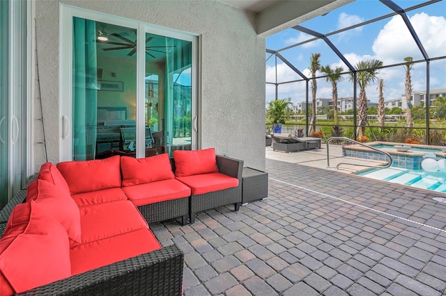 view of patio with an outdoor living space, glass enclosure, and an in ground hot tub