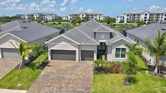 view of front facade featuring a garage and a front lawn