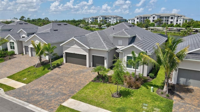 view of front of home featuring a garage and a front lawn